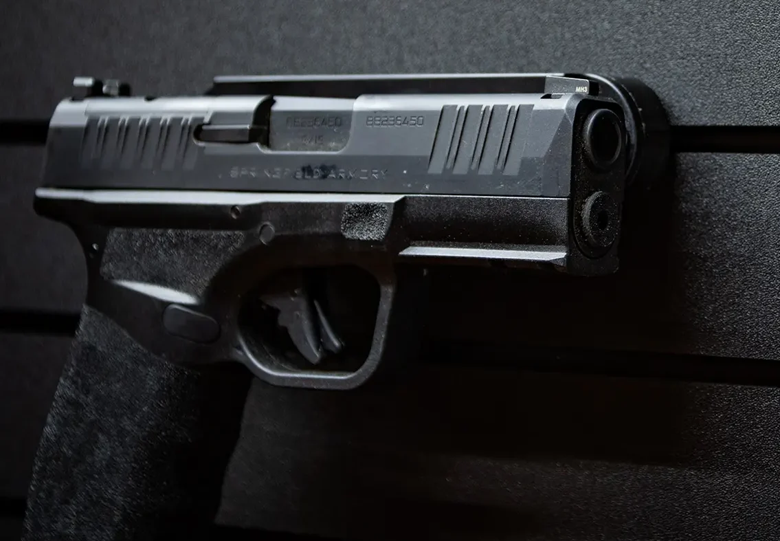 ModWall Hide-A-Mags Magnet accessory mounted on ModWall panel holding a handgun