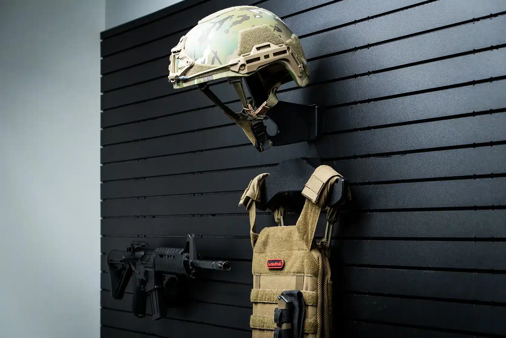 ModWall Helmet Hanger Wall mounted helmet hanger on ModWall panel beside other gear.