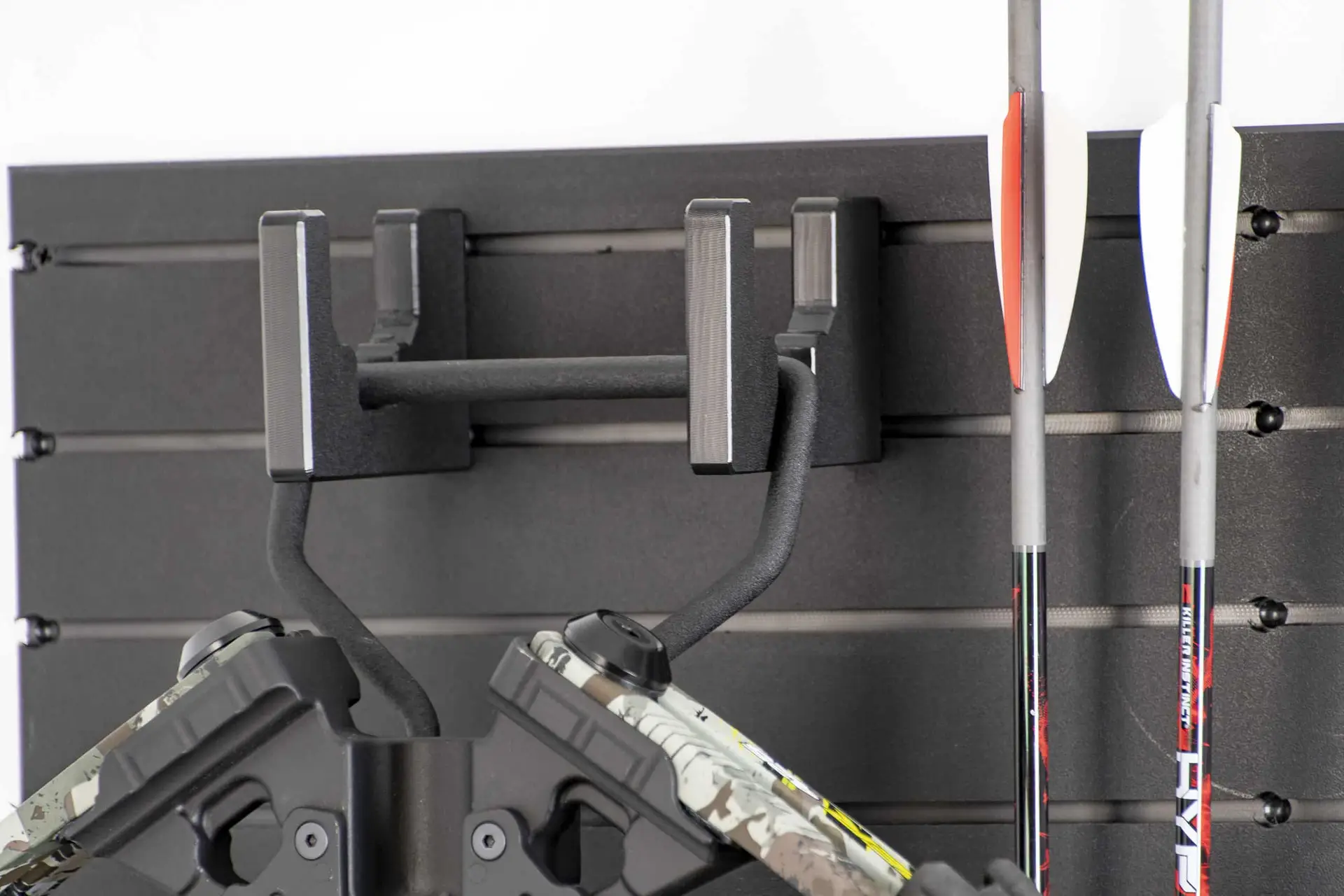 ModWall Archery Pack Strap block securing bow limbs against the panel