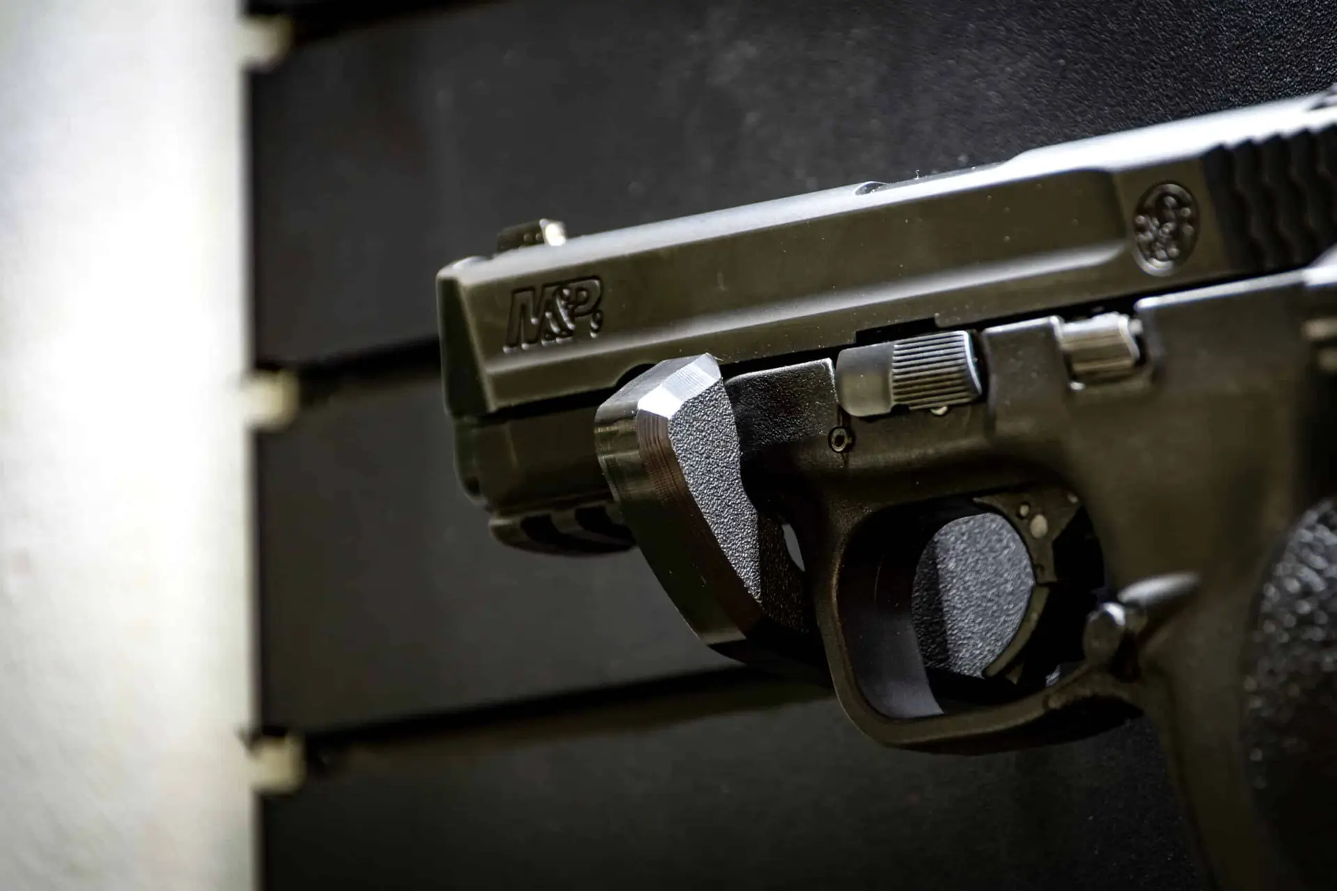 ModWall Handgun Rack Wall mounted handgun rack securing a full size pistol on panel.