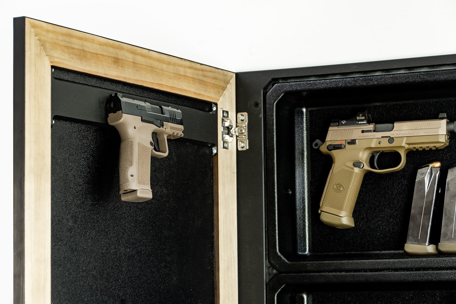 Mag Packs The open door of the product revealing a discreet compartment with two handguns and magazines mounted on a black interior surface.