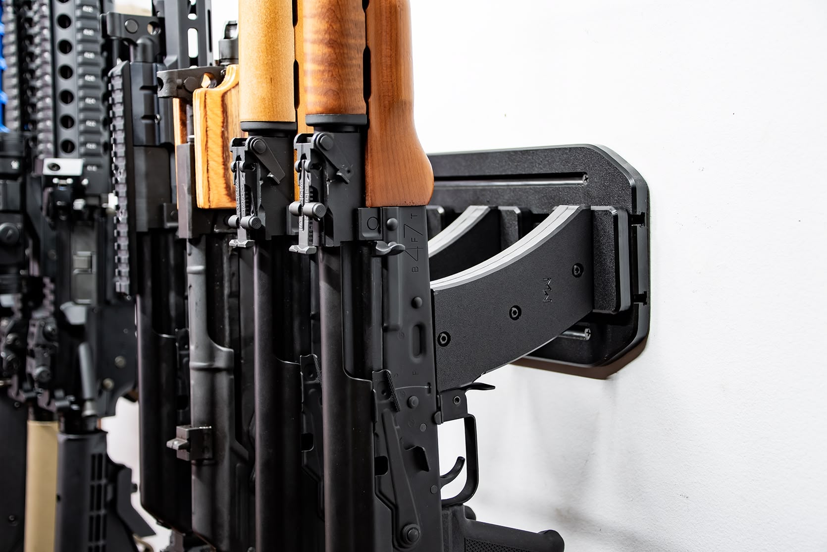 ModWall Vertical Rifle Hangers AR-15 and AK-47 locked on the wall