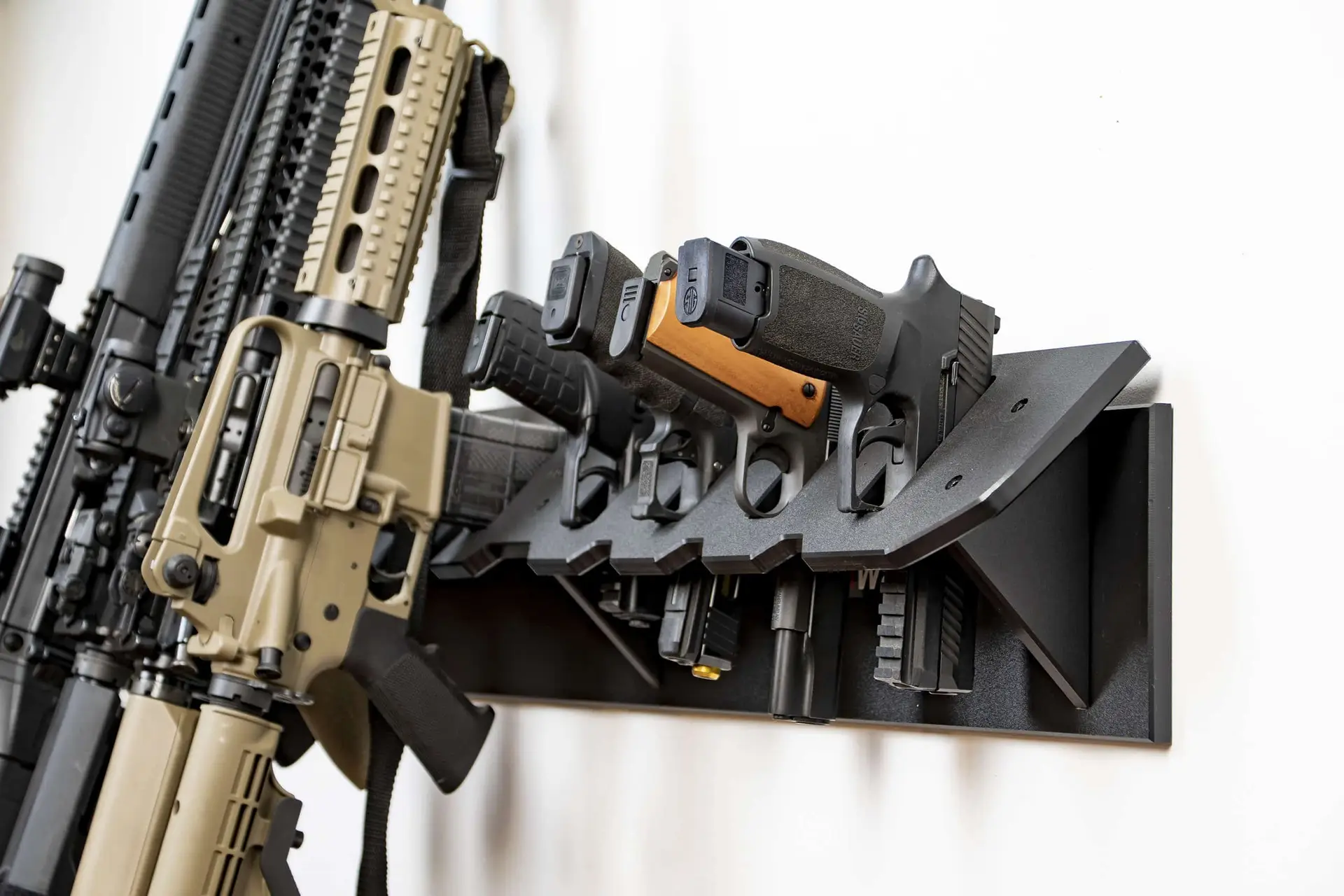 multi gun rack holding multiple rifles on wall