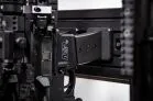 Modwall vertical rifle hangers holding an AR-style rifle by the mag well