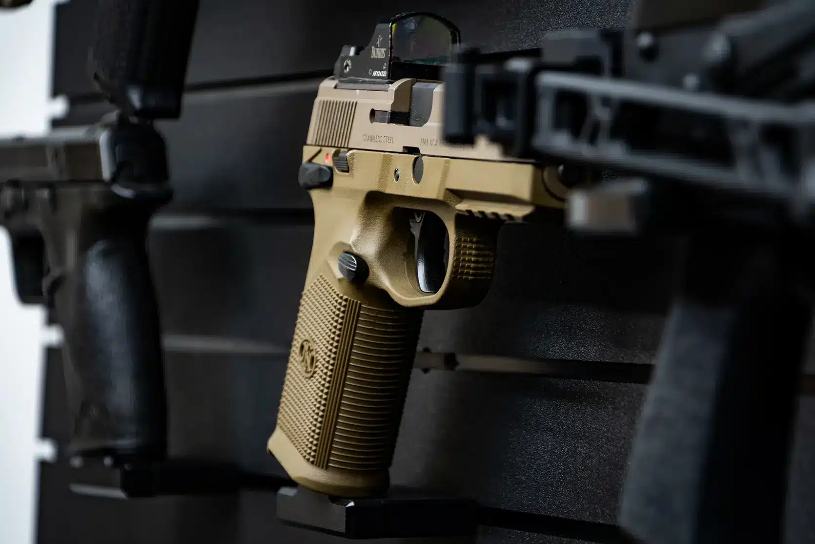 ModWall 9 Gun Combo Pack Close-up of a tan pistol with an optic mounted on a black ModWall Pistol Hanger.