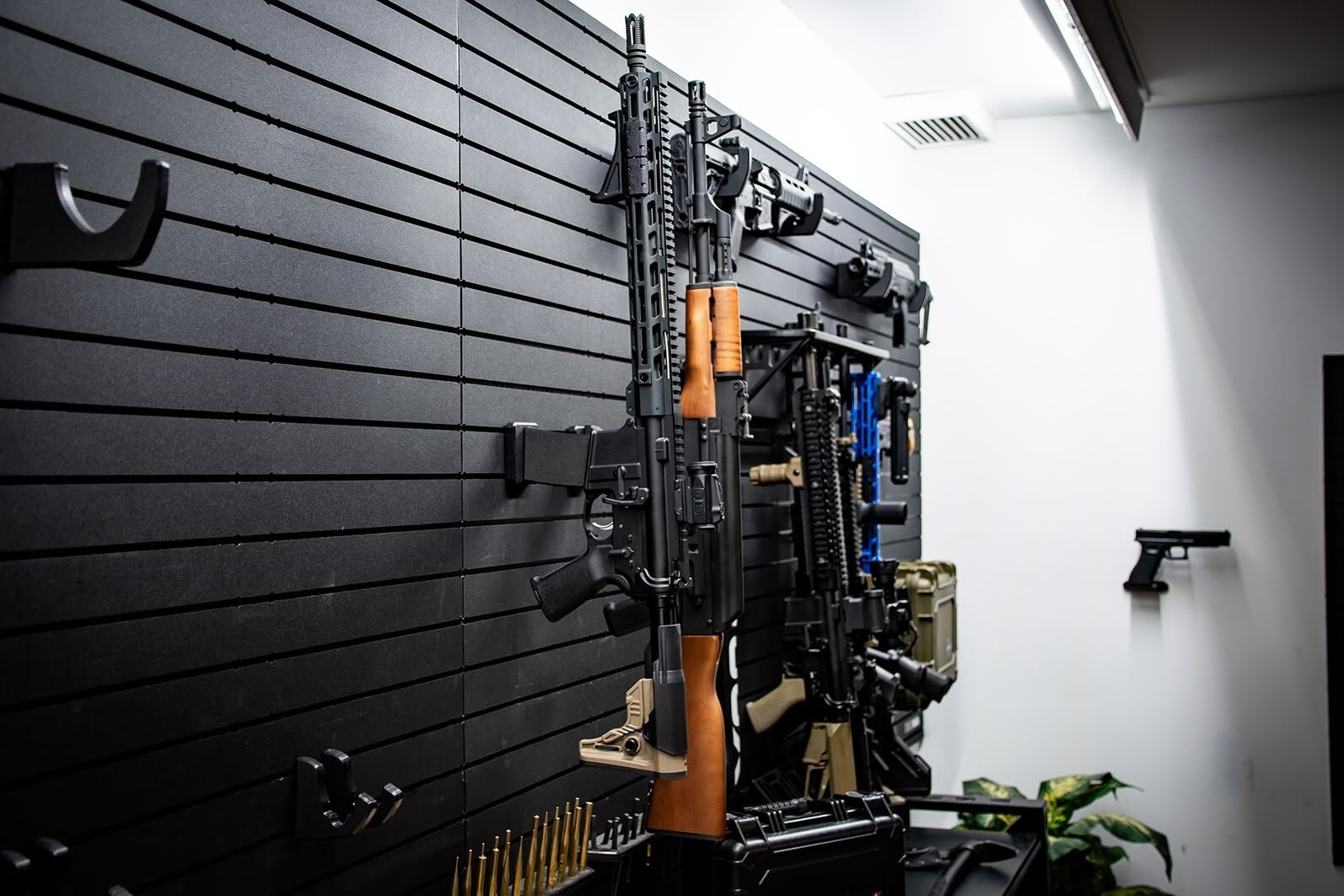 ModWall Vertical Rifle Hangers AR-15 and AK-47 locked on the wall