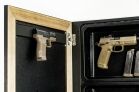1450 Framed Concealment Mirror The open door of the product revealing a discreet compartment with two handguns and magazines mounted on a black interior surface.