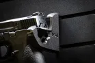 ModWall Handgun Rack Wall mounted handgun rack securing a full size pistol on panel.