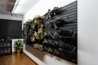 Yellowstone Marshals Arsenal Package Wide angled view of the ModWall Yellowstone Marshals Arsenal Package modular tactical wall featuring rifles, handguns, and plate carriers.