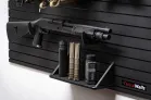 Yellowstone Marshals Gun Wall Package Lower shelf and shotgun mounting solution on the modular firearm storage system, including storage for magazines and tactical accessories.
