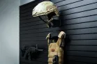 ModWall Helmet Hanger Wall mounted helmet hanger on ModWall panel beside other gear.
