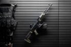 ModWall Sideways Vertical Rifle Rack A single rifle vertically mounted on a ModWall panel by its magazine.