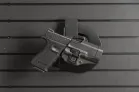 ModWall Holster Hanger A pistol in its Inside Waist-Band holster hung on the ModWall Holster Hanger.