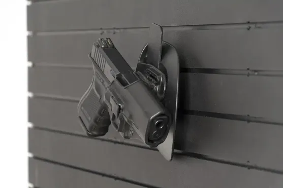 ModWall Holster Hanger A pistol in its holster sitting on the ModWall Holster Hanger, attached to a ModWall Panel.