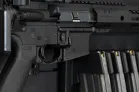 ModWall Magnetic Weapon Lock The 4-inch accessory hook going through the trigger guard of a wall mounted rifle.