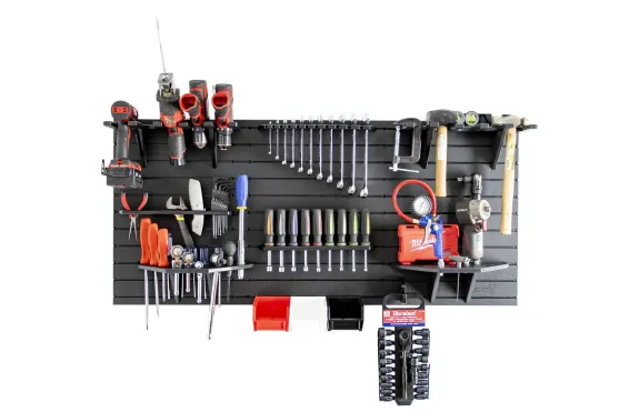 ModWall Project Package Complete modular tool wall organizer displaying power drills, combination wrenches, screwdrivers, air tools, hammers, pliers, storage bins, and shelves on a black HDPE panel against a white background.