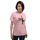 556 Nato Shirt | Day A female model wearing the pink color variant of the tee.