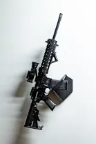 ModWall Sideways Vertical Rifle Rack A long gun mounted directly to the wall without a panel by the magazine.