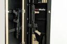 1450 Framed Concealment Mirror The interior of the product showing a tactical rifle, handgun, and magazines mounted vertically against a black background with the "Tactical Walls" logo.