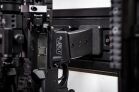 Vertical 8 Rifle Package Modwall vertical rifle hangers holding an AR-style rifle by the mag well