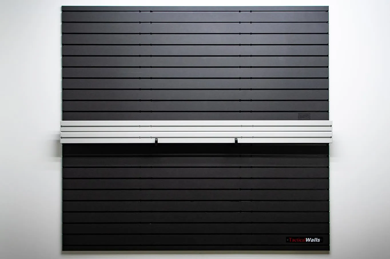 ModWall Ceiling Panel Strip (48″x4″) A ModWall Ceiling Panel Strip mounted horizontally between two black ModWall panels.