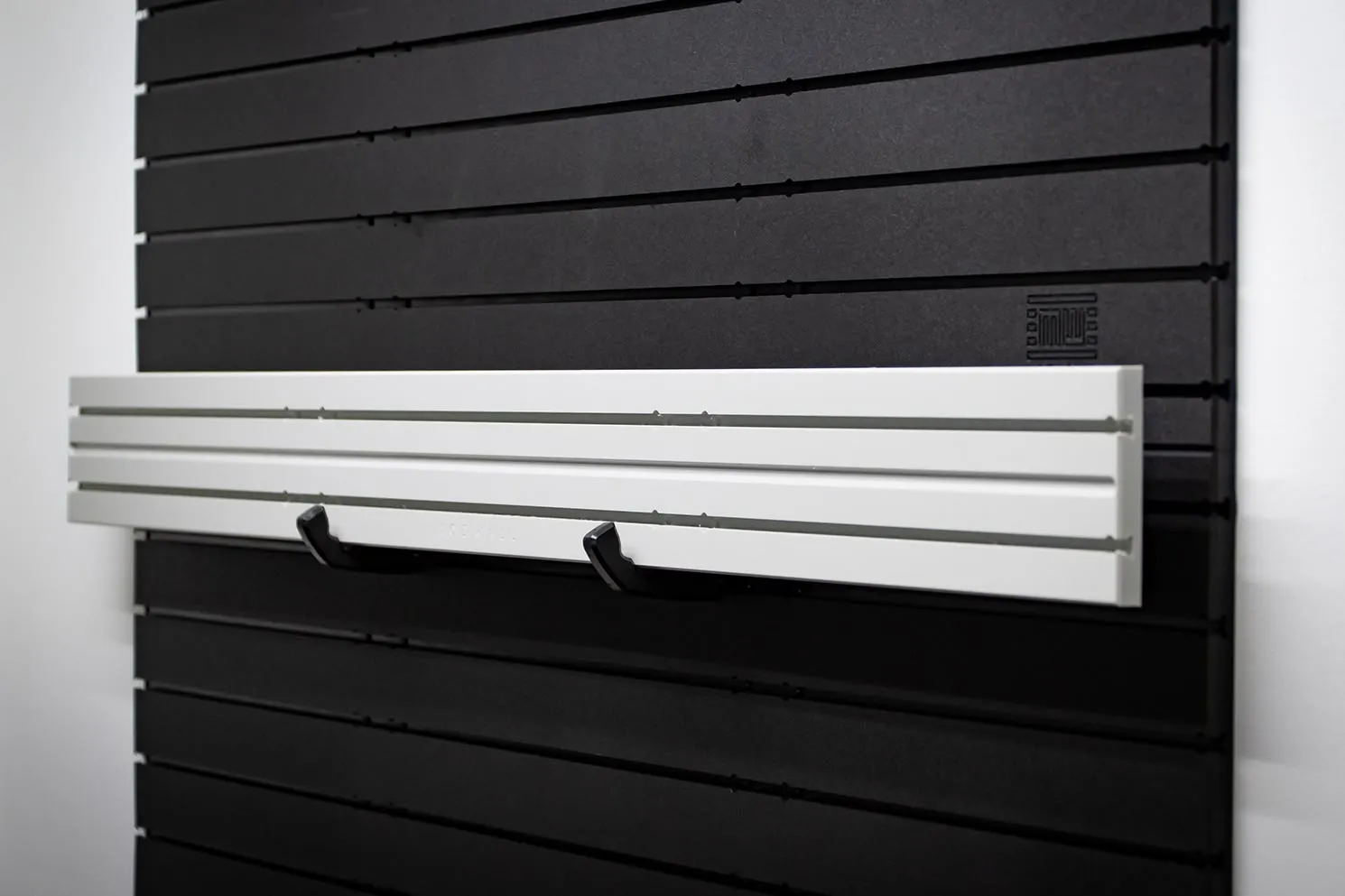 ModWall Ceiling Panel Strip (48″x4″) A side-angle of the product's usage on a wall.