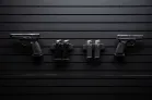 ModWall Hide-A-Mags Magnet accessory mounted on ModWall panel holding a handgun