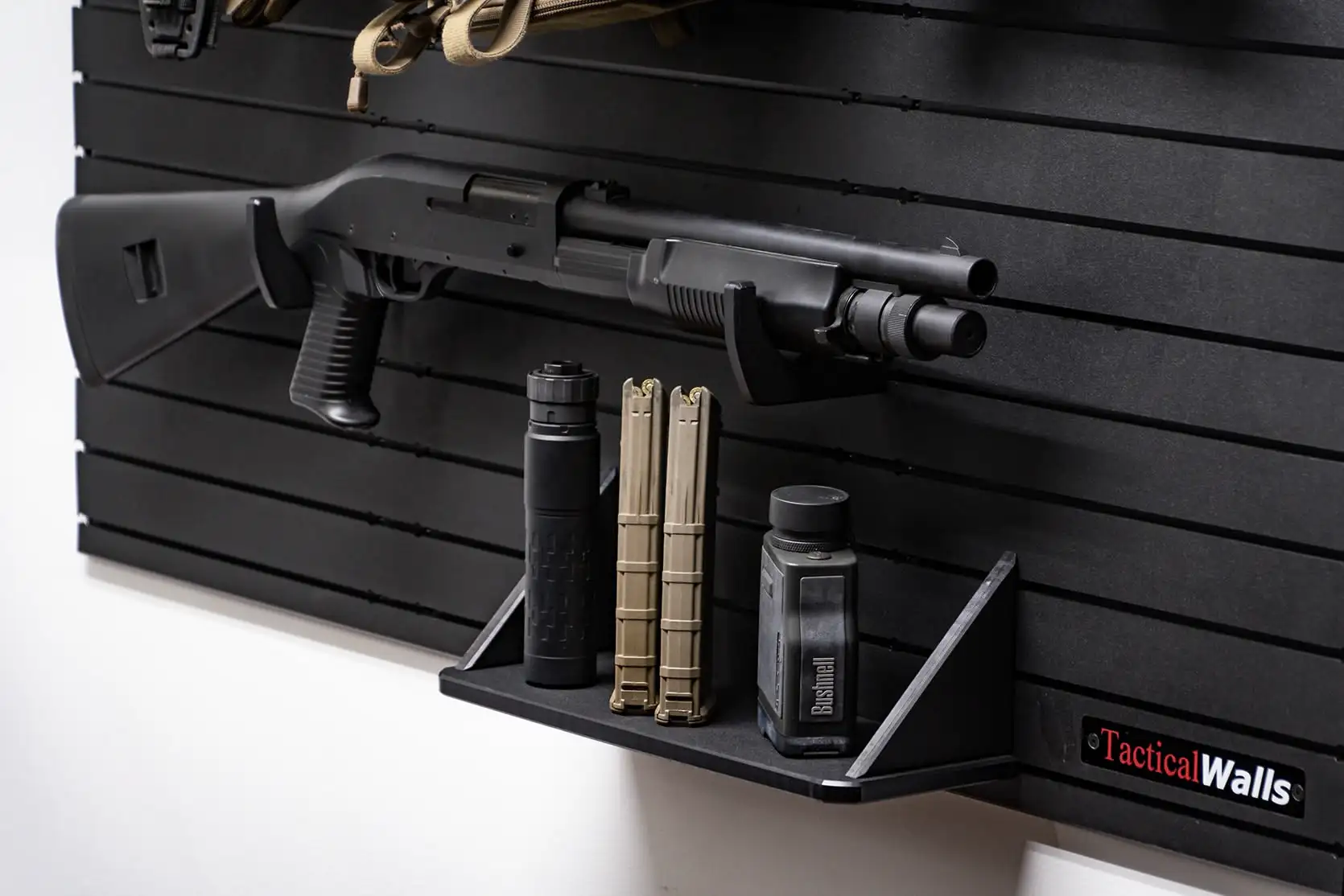 Yellowstone Marshals Gun Wall Package Lower shelf and shotgun mounting solution on the modular firearm storage system, including storage for magazines and tactical accessories.