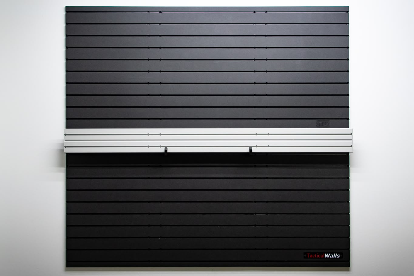 ModWall Ceiling Panel Strip (48″x4″) A ModWall Ceiling Panel Strip mounted horizontally between two black ModWall panels.
