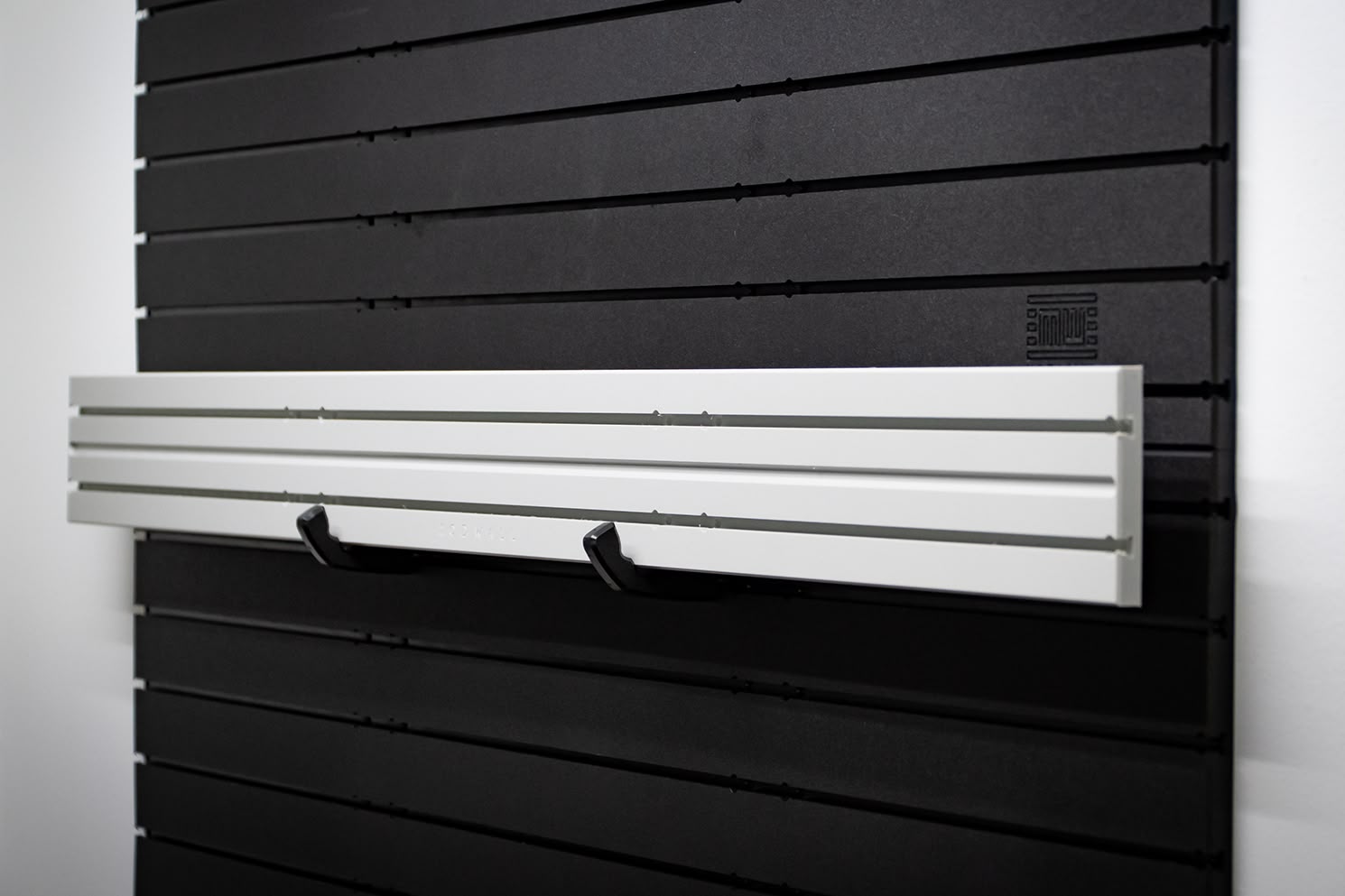 ModWall Ceiling Panel Strip (48″x4″) A side-angle of the product's usage on a wall.