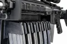 MidMod Rifle Display Package A close-up view of a firearm receiver with an optional magazine rack positioned directly below it.