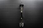 ModWall Vertical One Rifle Rack A rifle mounted vertically on a black ModWall panel using the ModWall Vertical One Rifle Rack, featuring a secure upper hook and lower shelf.