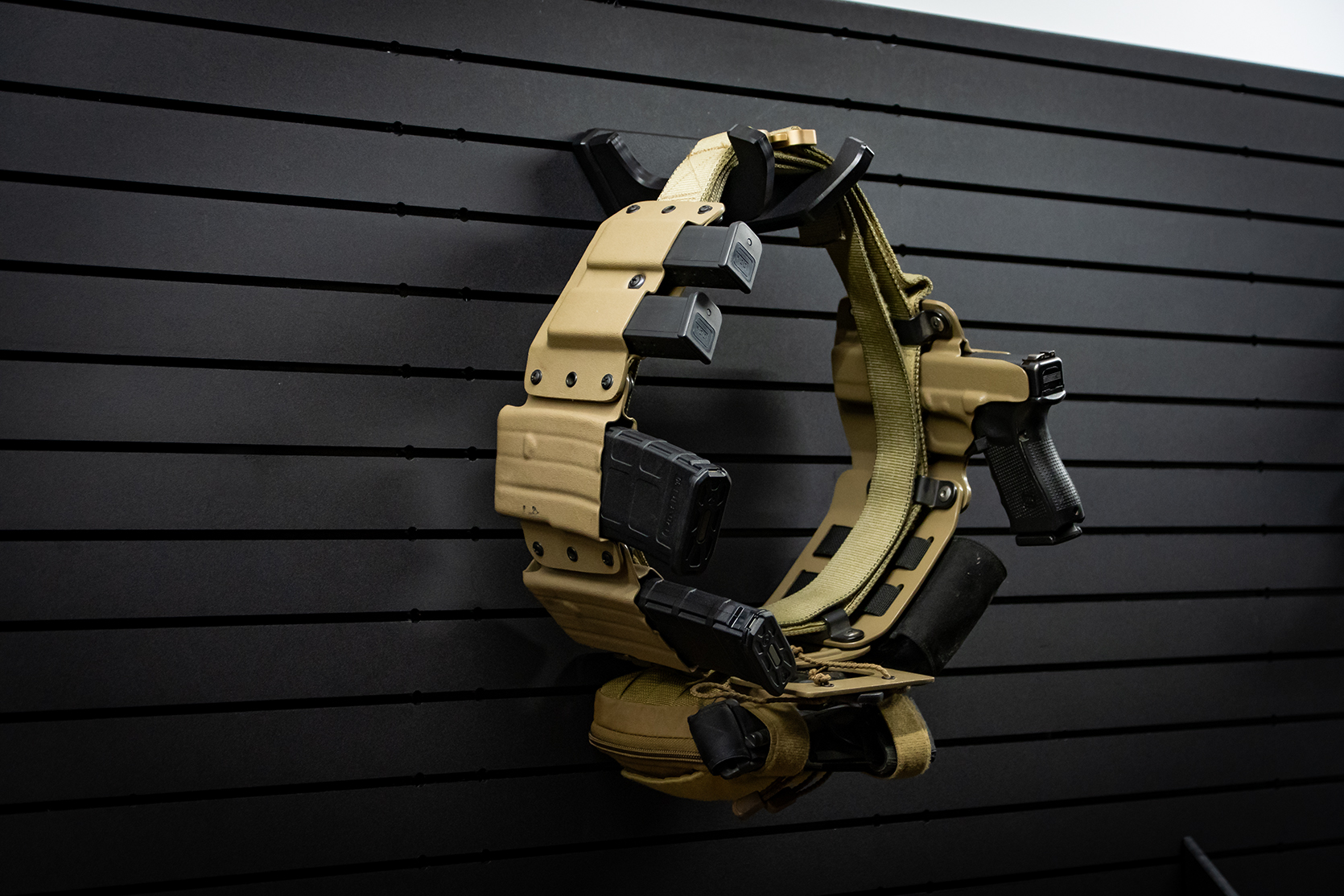 Duty belt holder mounted on a ModWall panel.
