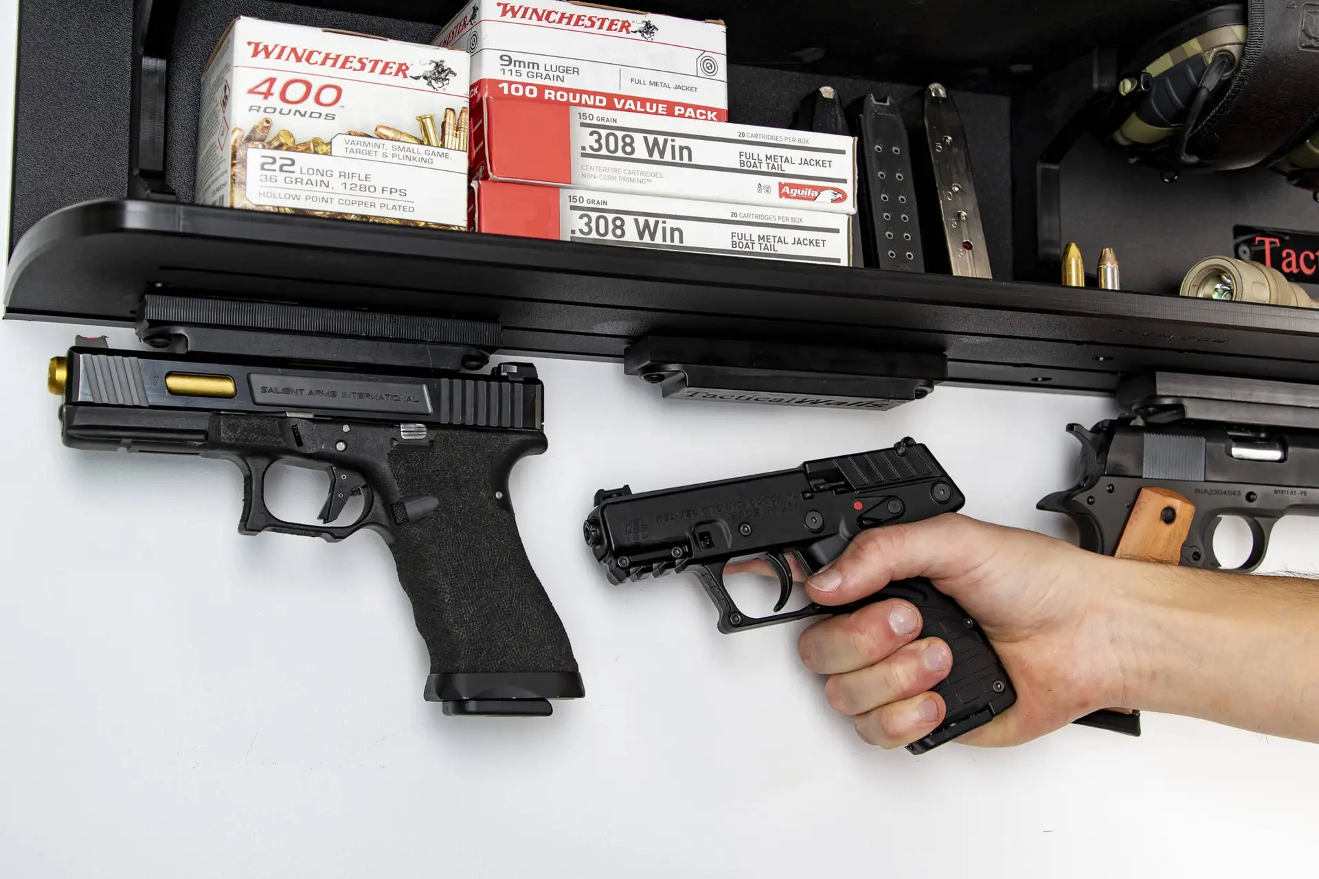 ModWall Dual Shelf Package ifestyle shot of a garage wall with dual shelf gun storage and accessories.
