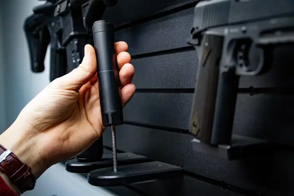 suppressor holder mounted on ModWall panel with silencer stored