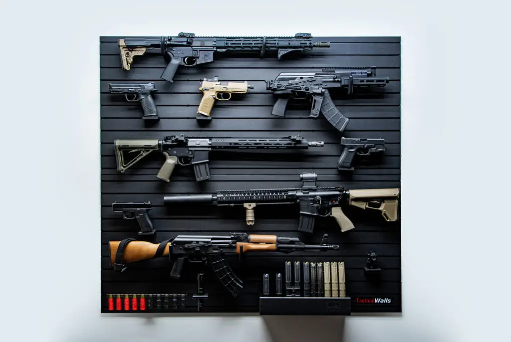 ModWall 9 Gun Combo Pack A ModWall 9 Gun Combo Pack mounted on a wall, showcasing a customizable layout of rifles, pistols, and tactical accessories on a black modular panel.