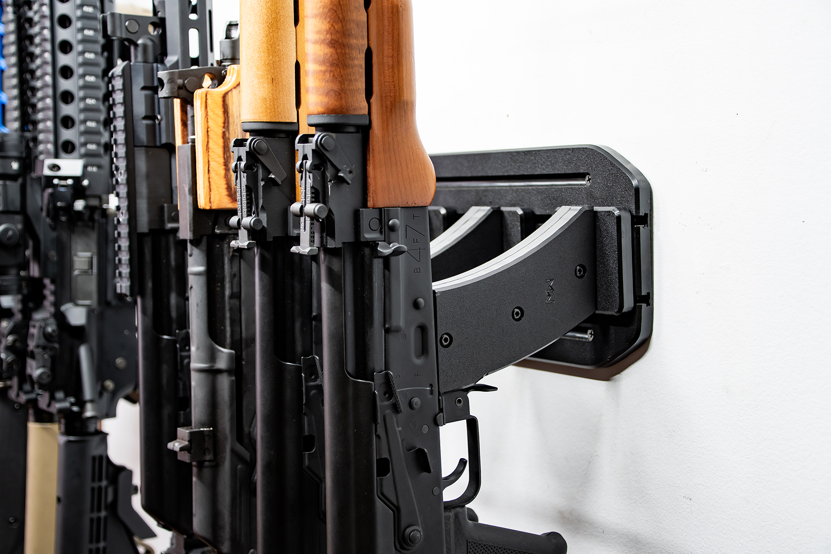 ModWall Vertical Rifle Hangers AR-15 and AK-47 locked on the wall