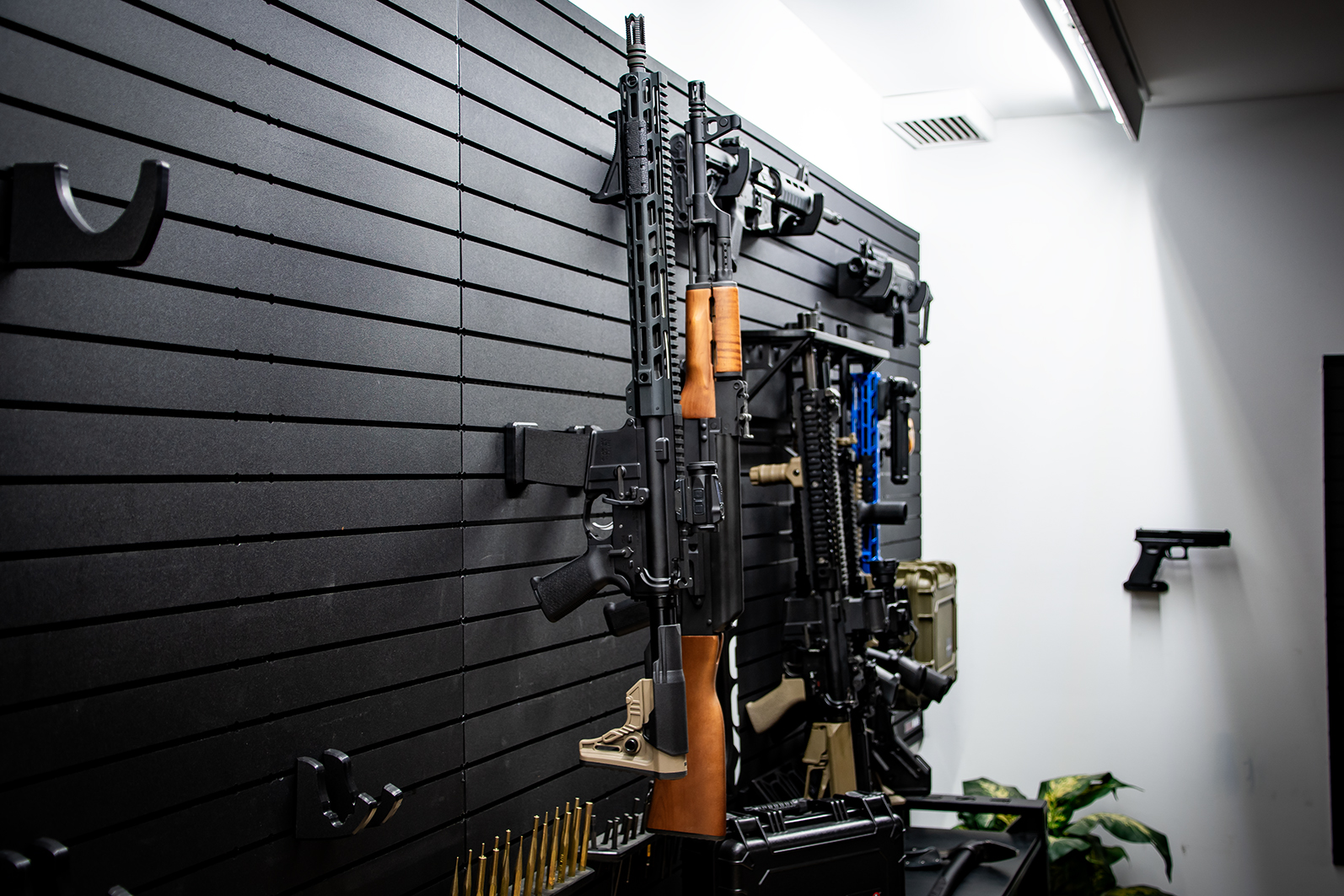 ModWall Vertical Rifle Hangers AR-15 and AK-47 locked on the wall