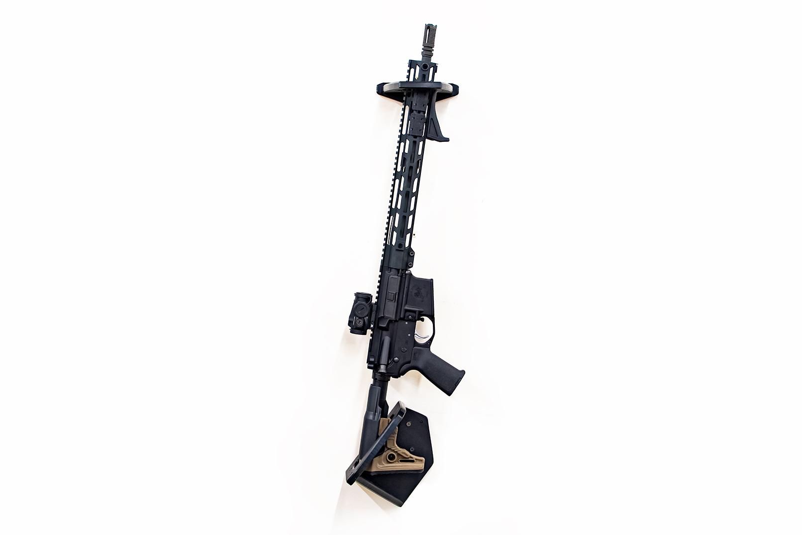 ModWall Sideways Vertical Rifle Rack A black rifle mounted vertically and directly on a wall with the side profile facing outward.
