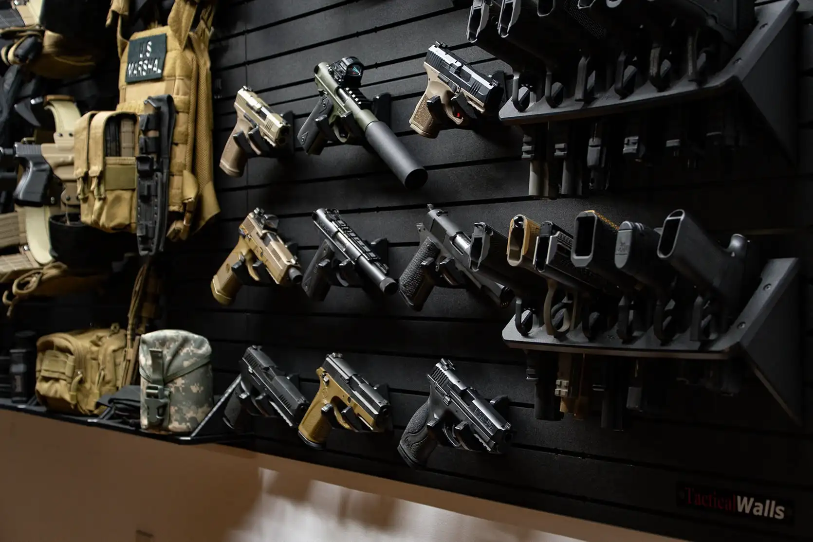 Yellowstone Marshals Arsenal Package Close-up of the pistol mounting section on the Yellowstone Marshals Arsenal Package, featuring multiple handguns and a high-capacity pistol rack on a slat wall.