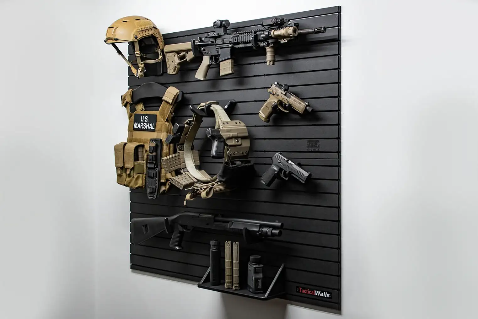 Yellowstone Marshals Gun Wall Package Angled shot of the Yellowstone Marshals Gun Wall Package featuring organized tactical storage for firearms, a ballistic helmet, and a tan plate carrier.