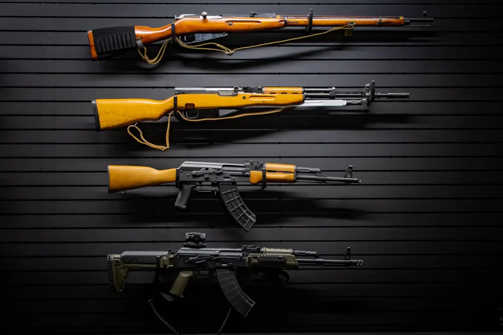 Main display wall showcasing four different long guns arranged cleanly on ModWall Horizontal Gun Racks.